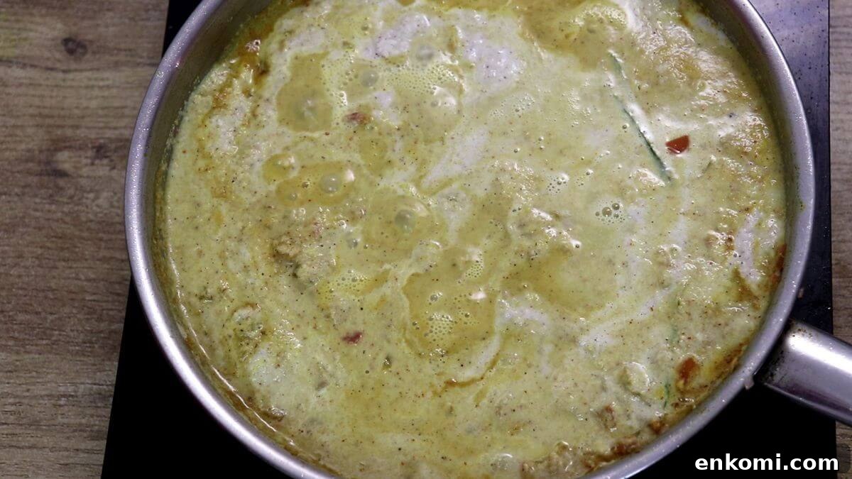 Authentic Goan Clam Curry Recipe 12 Adding water to adjust the consistency of clams curry.