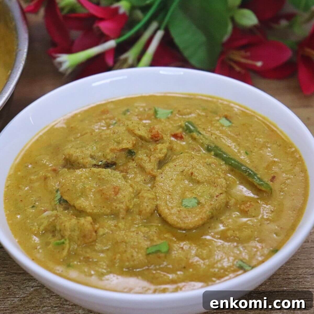 Authentic Goan Clam Curry Recipe 15 Authentic Goan Tisryache Tonak clam curry served in a white bowl.