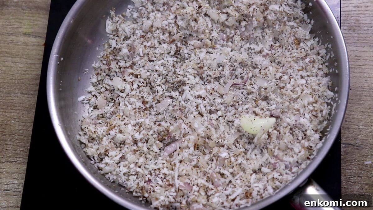 Authentic Goan Clam Curry Recipe 5 Roasting grated coconut until golden.