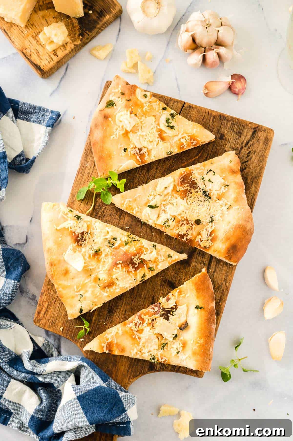 Garlic Lover's Pizza with Homemade Crust Recipe 10 Slices of pizza on a cutting board.