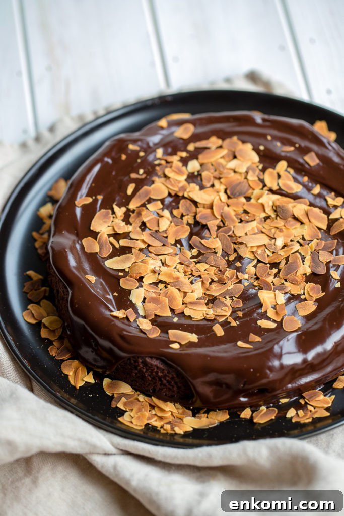 Decadent Flourless Chocolate Cake Recipe 6 Gluten-free chocolate cake topped with chocolate ganache and toasted slivered almonds.
