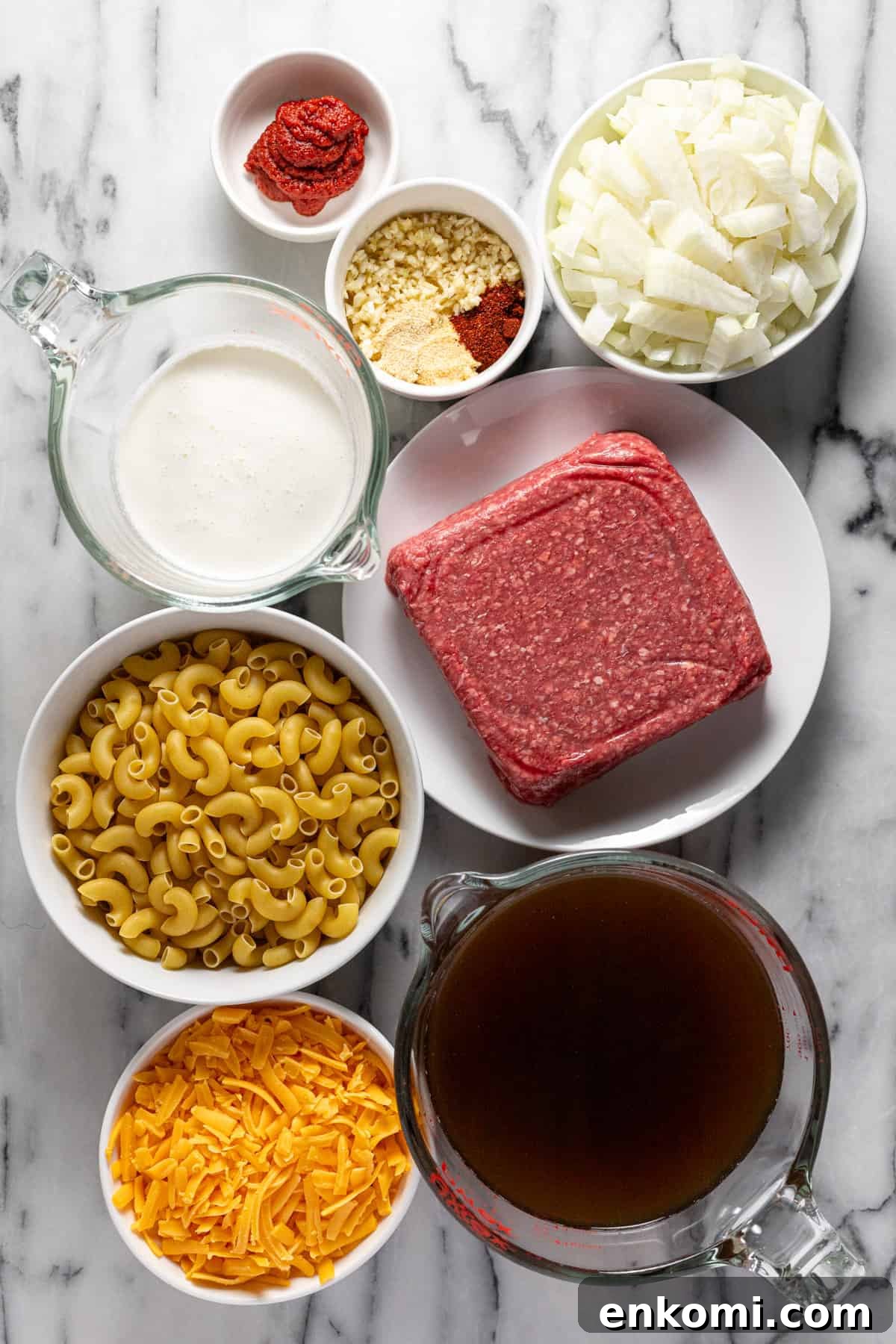 Bowls of ingredients to make hamburger helper at home.