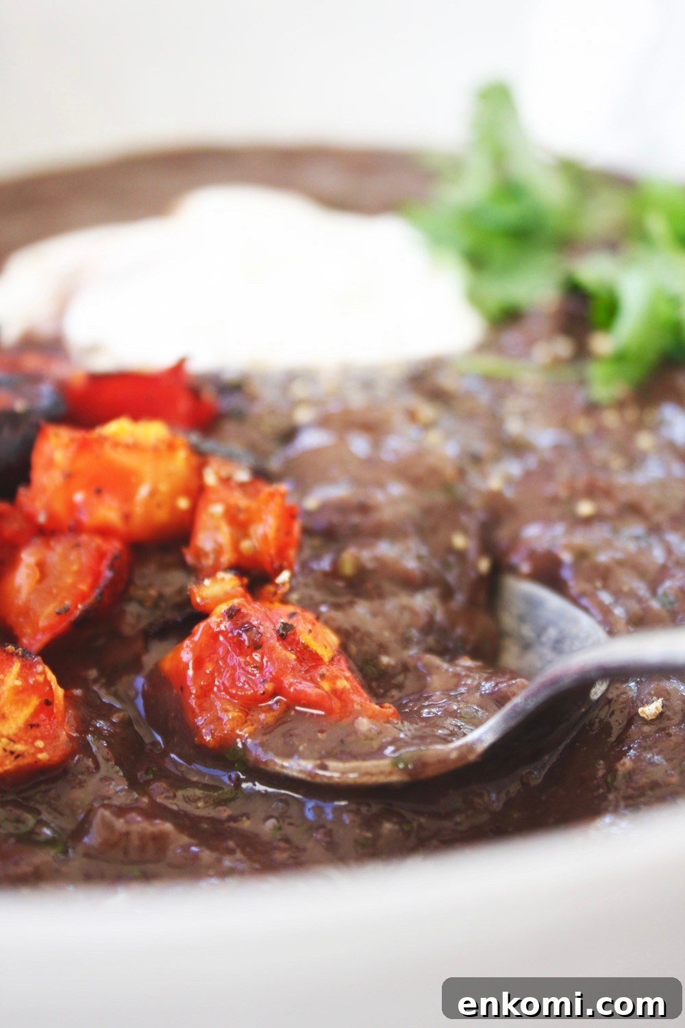 Close-up of black bean soup with toppings