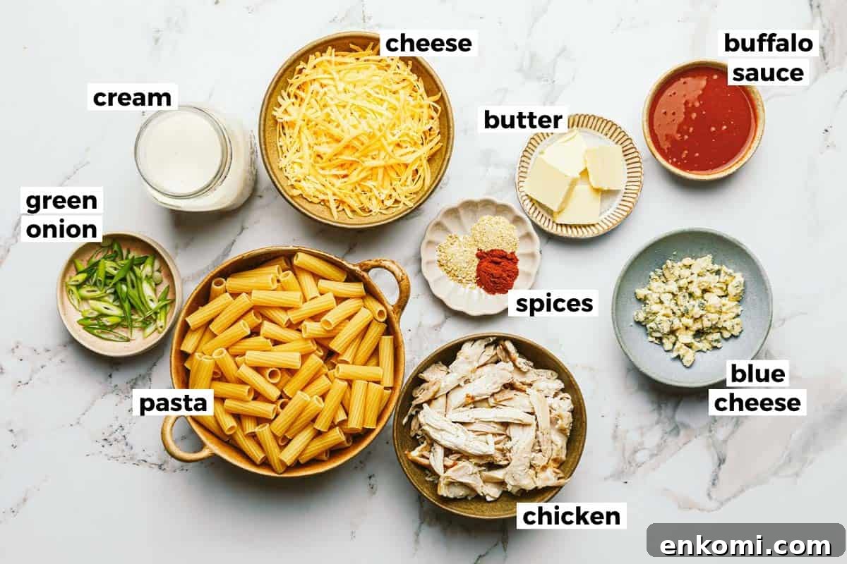 One-Pot Creamy Buffalo Chicken Pasta 3 Bowls of ingredients to make buffalo chicken pasta.