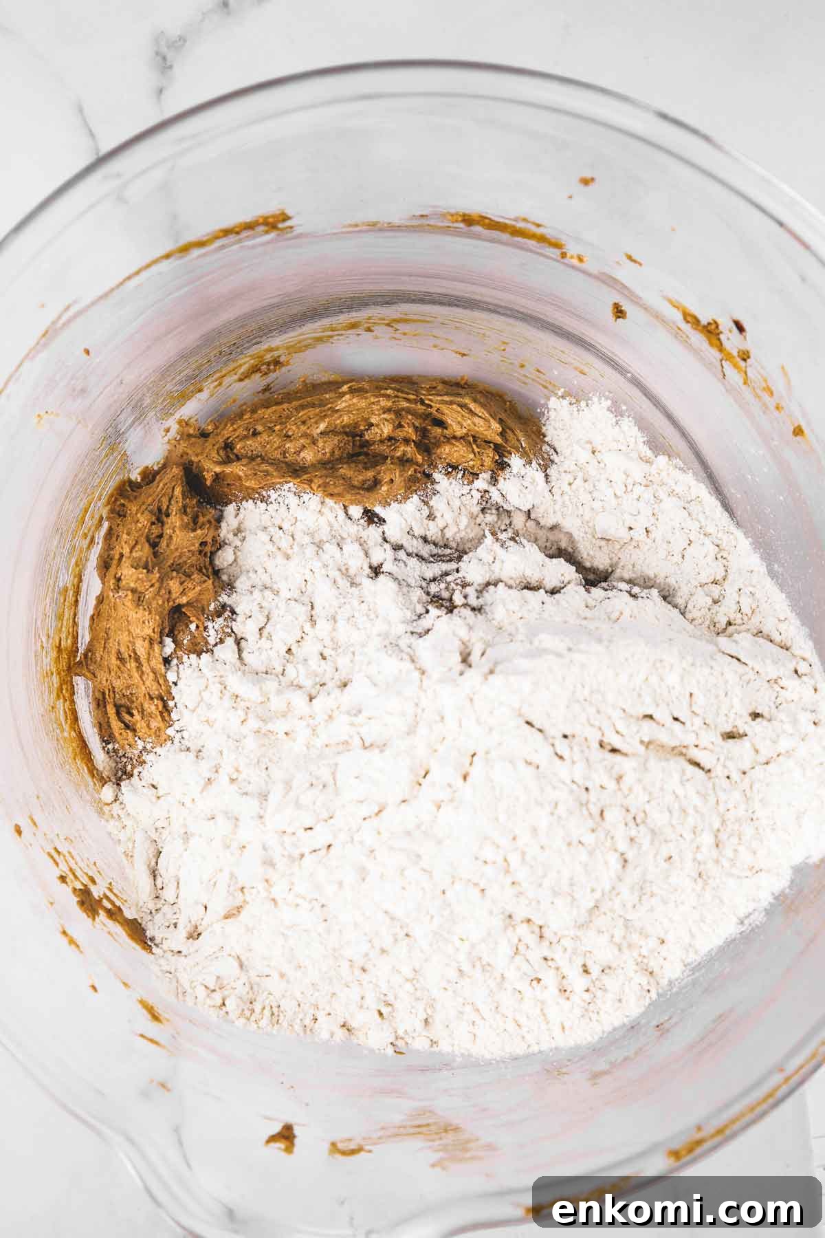 Gingerbread Spice Cookies with Cream Cheese Frosting 7 Rolling dough in sugar