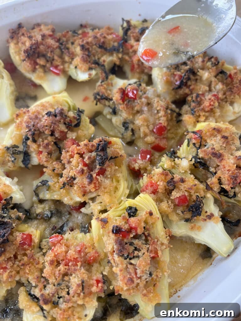 Oven-Roasted Italian Artichoke Hearts with Lemon Breadcrumbs 16 Drizzling some pan sauce over baked italian artichoke hearts.