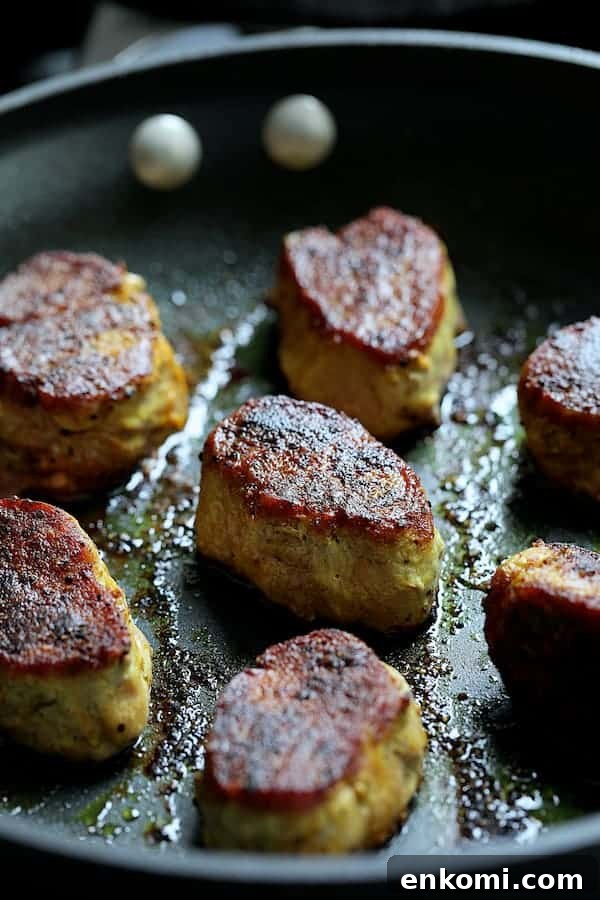 Spicy Tahini Pork Medallions with Harissa Sweet Potato Wedges 7 Photo of pork medallions in skillet after being seared.