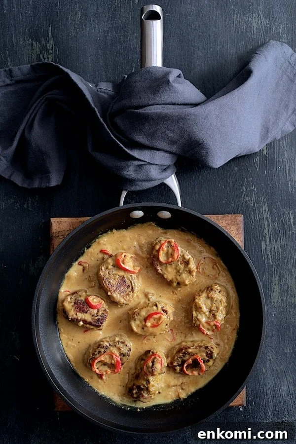 Spicy Tahini Pork Medallions with Harissa Sweet Potato Wedges 9 Photo of Spicy Tahini Pork Medallions in skillet.