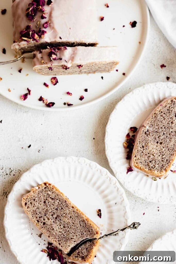 Vegan Rose Loaf Cake with Silky Petal Glaze 3 rose loaf cake slices on plates with scattered rose petals