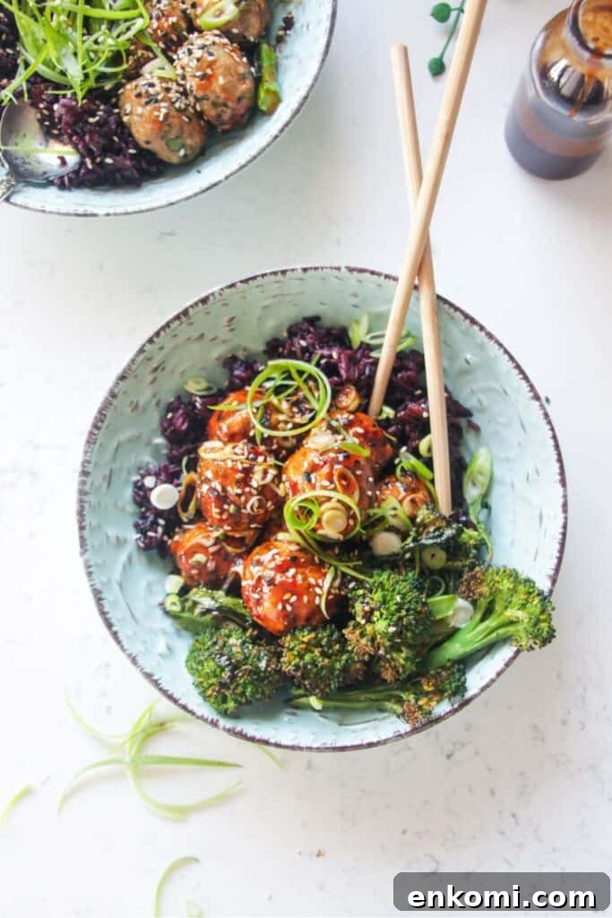 20-Minute Marry Me Chicken with Creamy Sun-Dried Tomato Sauce 13 Glazed Asian chicken meatballs with rice and broccoli in a small blue bowl.