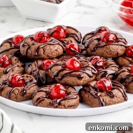 a close up shot of Chocolate Cherry Cookies on a plate