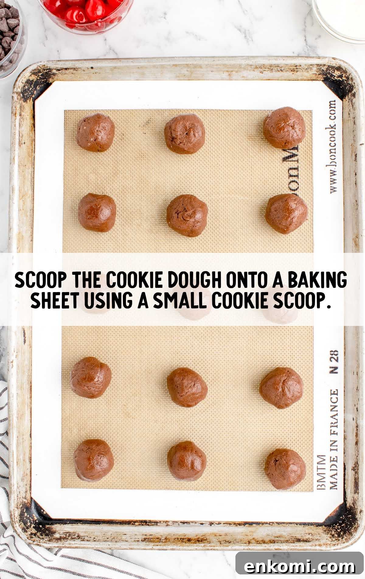 cookie dough scooped onto a baking sheet