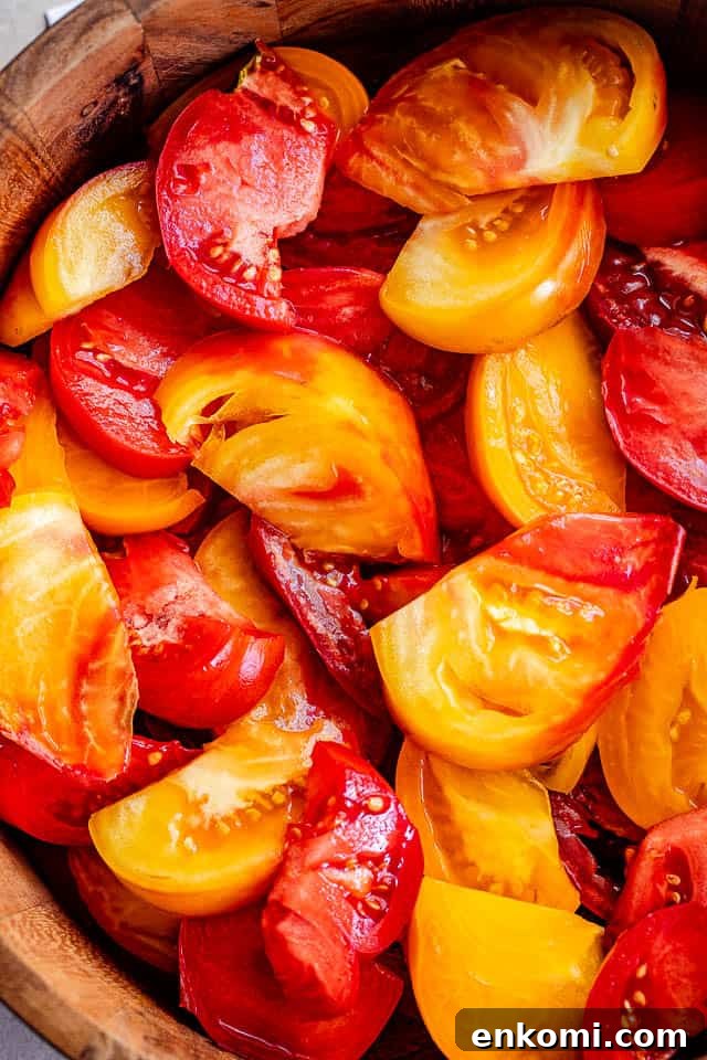 Creamy Avocado and Tomato Salad with Lime Vinaigrette 3 wedges of heirloom tomatoes in a salad bowl