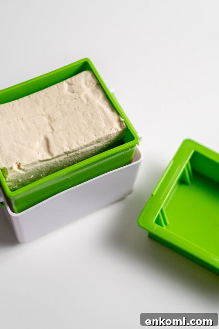 How to Press Tofu for Crispy, Firm Results 8 A block of tofu in a tofu press.