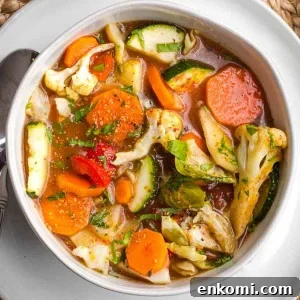 Colorful and chunky vegetables in a brothy soup.