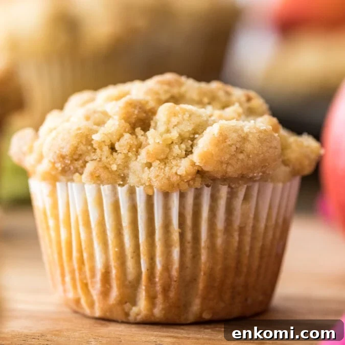 30 Muffin Recipes: Sweet, Savory & Seasonal Ideas 11 close-up shot of an apple muffin topped with streusel