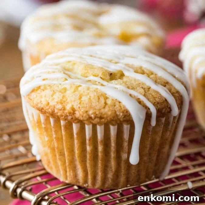 30 Muffin Recipes: Sweet, Savory & Seasonal Ideas 14 Peach muffins drizzled with vanilla glaze on a cooling rack.