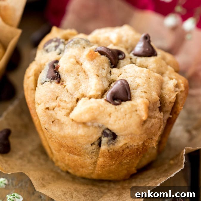 30 Muffin Recipes: Sweet, Savory & Seasonal Ideas 23 peanut butter muffin with chocolate chips on parchment paper