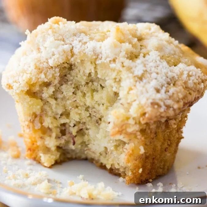 30 Muffin Recipes: Sweet, Savory & Seasonal Ideas 5 streusel topped banana muffin missing a bite