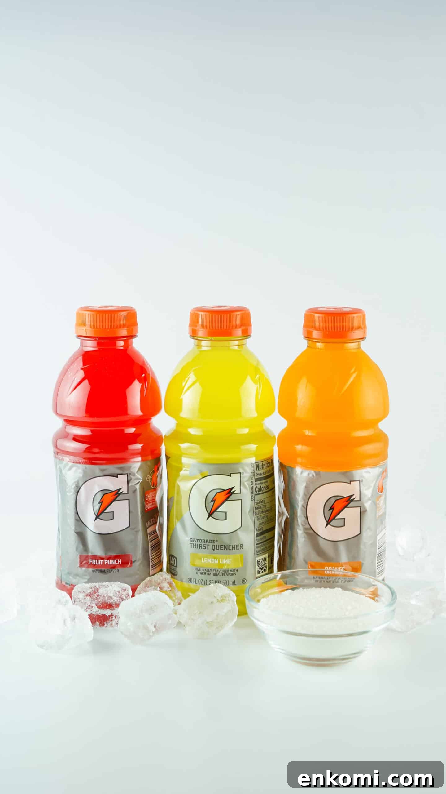 Gatorade Slushie Recipe: 3 Ingredients for Icy Drinks 5 gatorade bottles, ice and sugar on white table
