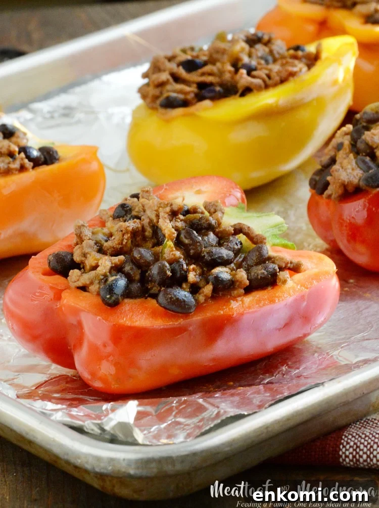sriracha beef taco stuffed peppers on sheet pan