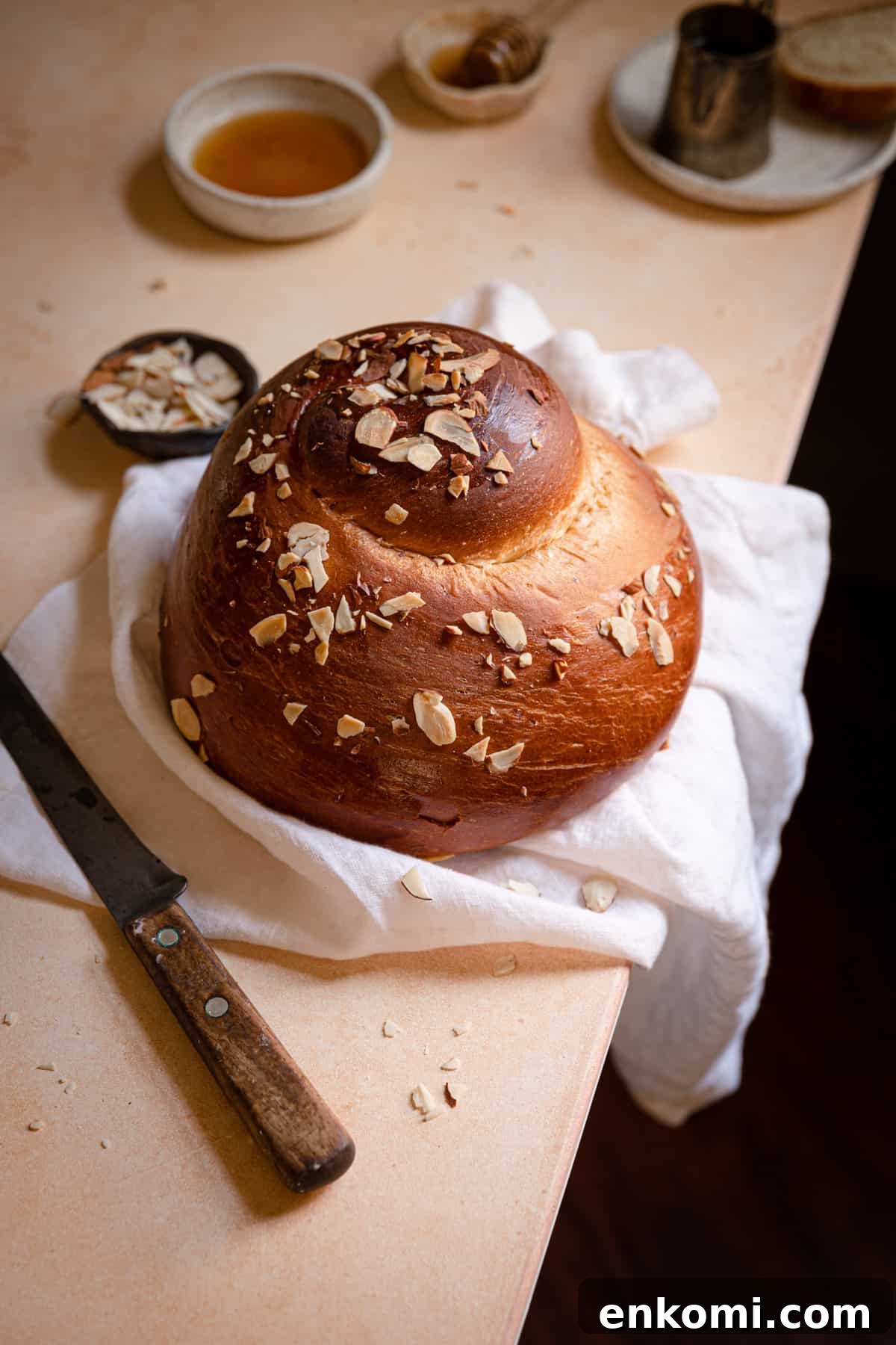 round Challah with a knife next to it