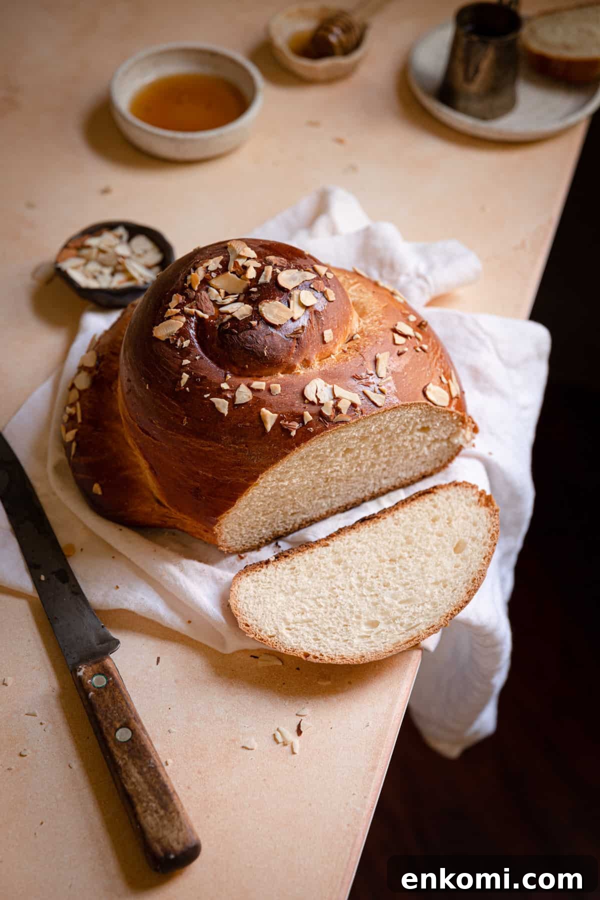 sliced round bread sprinkled with almonds